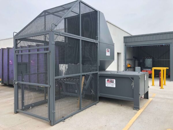 Static Compactor Loaded by Integrated Wheelie Bin Lift fully enclosed by Cage