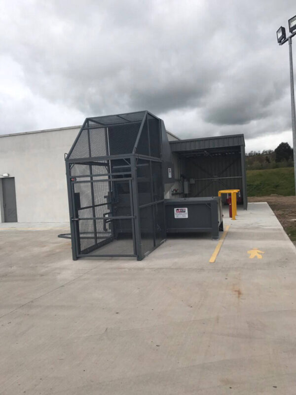Static Compactor Loaded by Integrated Wheelie Bin Lift fully enclosed by Cage