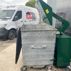 Wheelie bin compactor in green