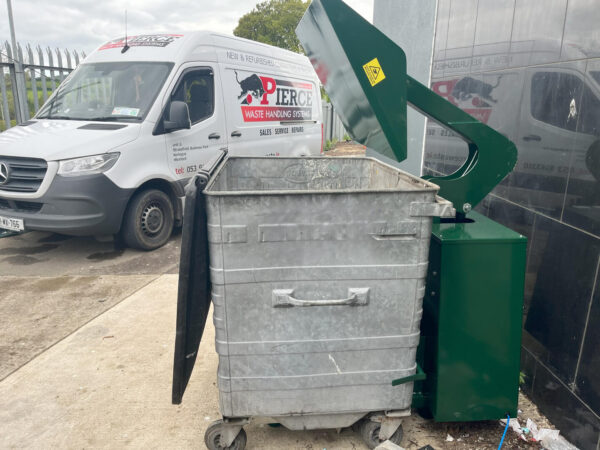 Wheelie bin compactor in green